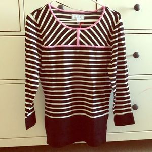 Women’s black and white striped dress shirt.